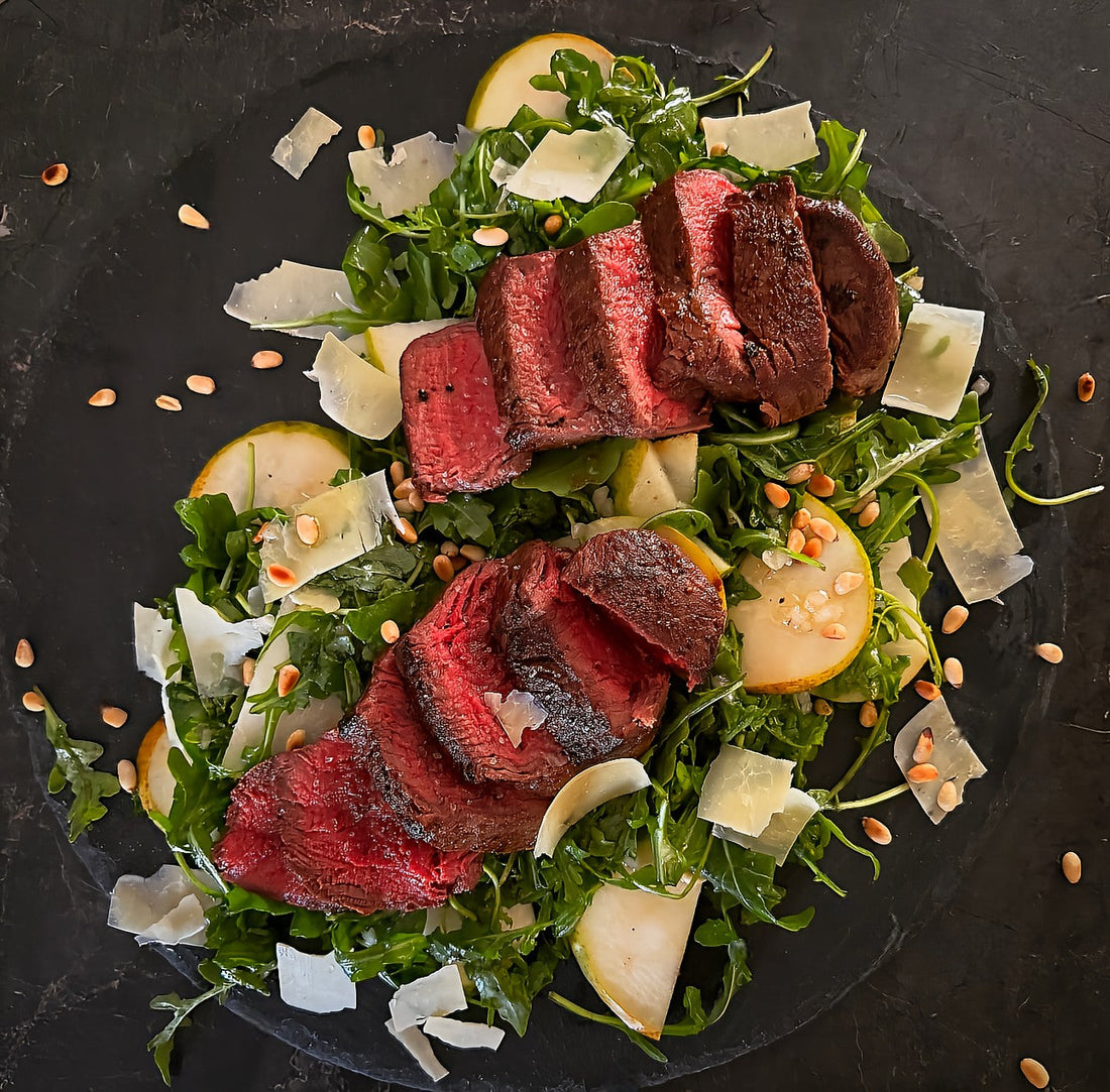 Eye fillet with rocket, pear, and Parmesan salad