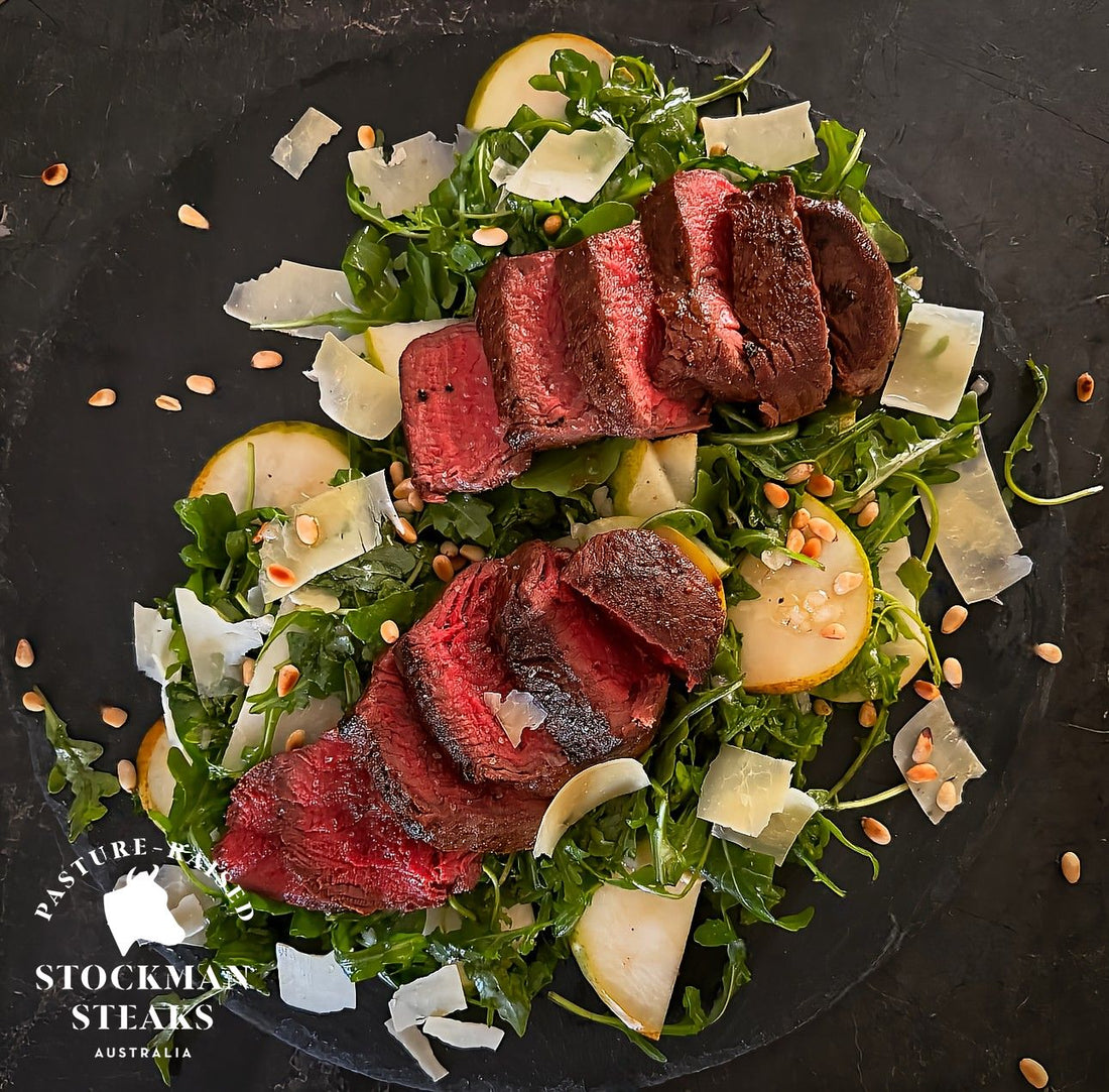 Eye fillet with rocket, pear, and Parmesan salad